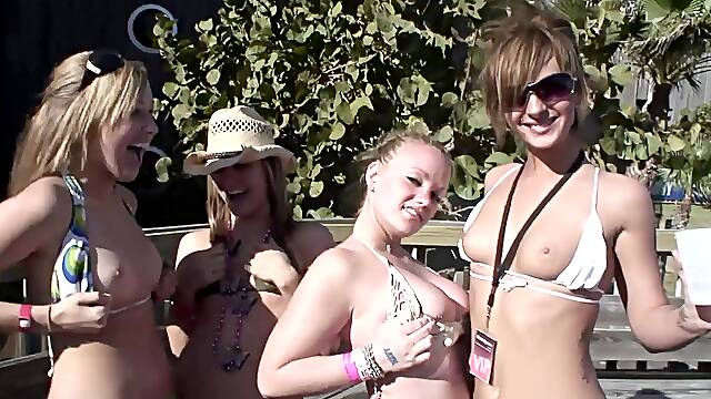 Salacious amateur cowgirls pose seductively in bikinis at an outdoors party