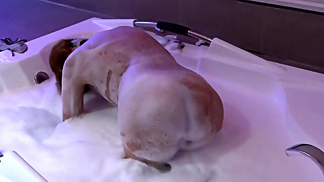 Before enjoying my bosss huge cock, I go to the motels jacuzzi and start to get aroused.